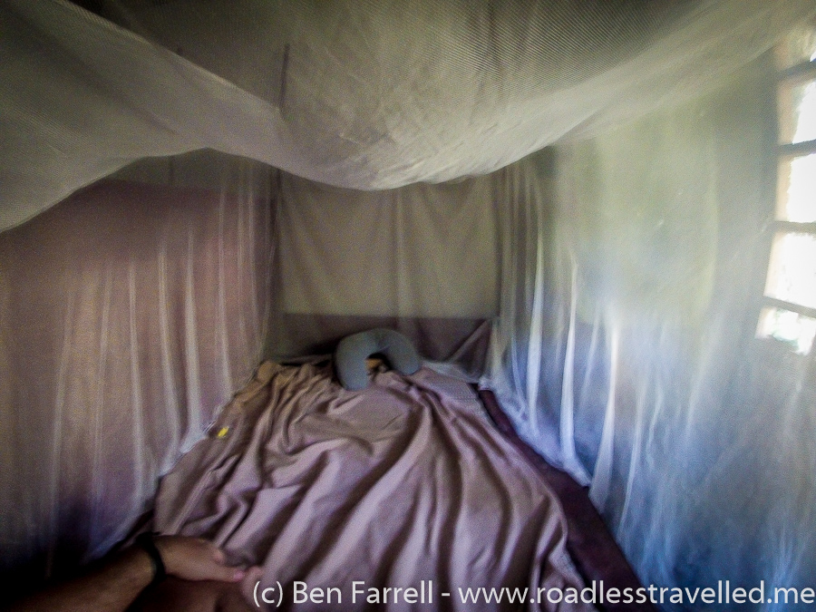 My 'bed' - A wooden platform with a straw mat and a mosquito net. Note *Travel Pillow not included. Thank God I had this on me as it saved me from the wooden pillow provided.